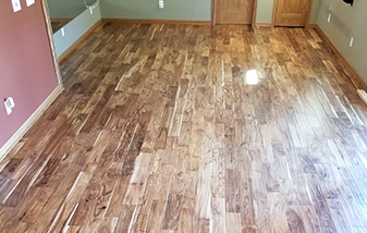 Acacia wood floors changed the feel of this lower level